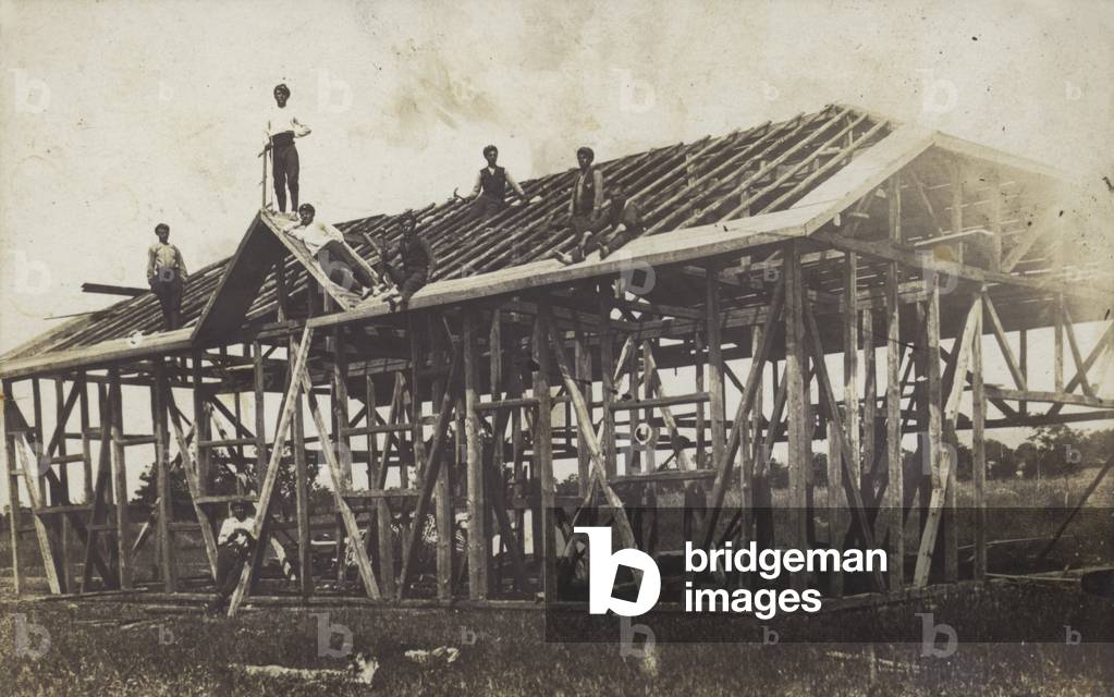 Construction of a timber-framed municipal building in Bulgaria, 1910s or 1920s (b/w photo)