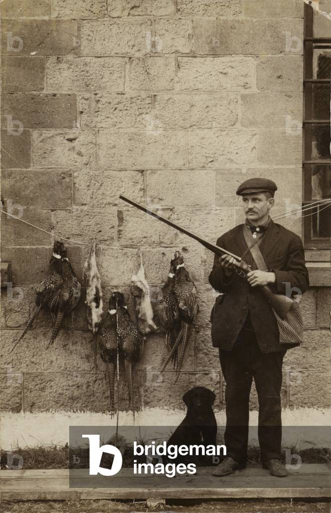 Hunter with pheasants (b/w photo)