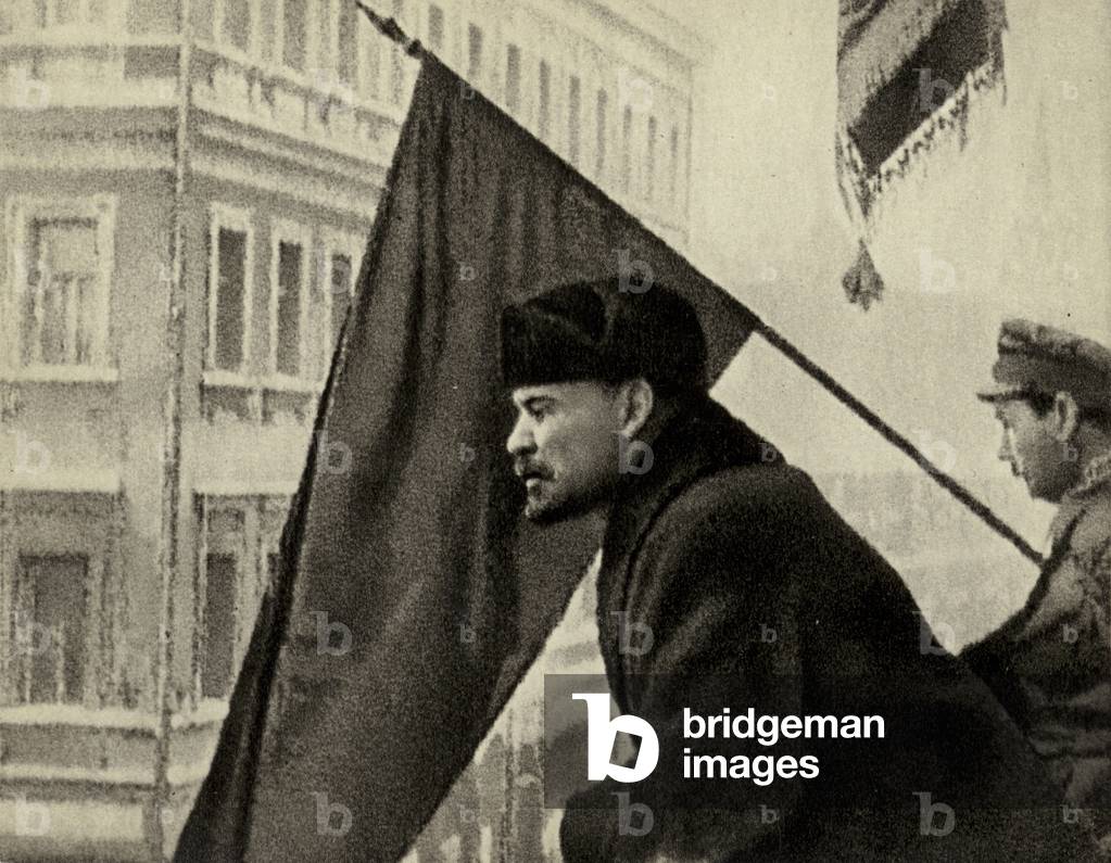 Lenin greets, from the balcony of the Moscow Soviet, Communist worker troops leaving to fight Denikin, Moscow, 16 October 1919 (b/w photo)