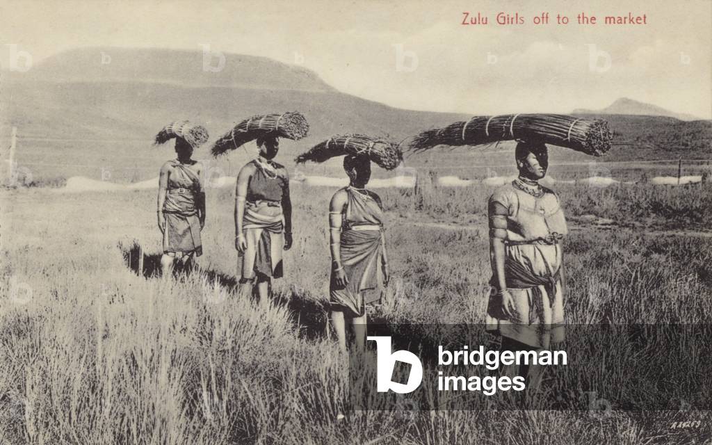 Postcard depicting Zulu girls off to market (b/w photo)