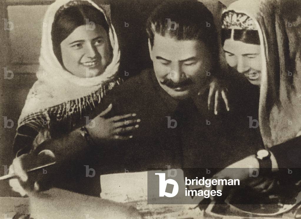 Soviet leader Joseph Stalin talking with Stakhanovite Kolkhoz workers from the cotton fields, 1934 (b/w photo)