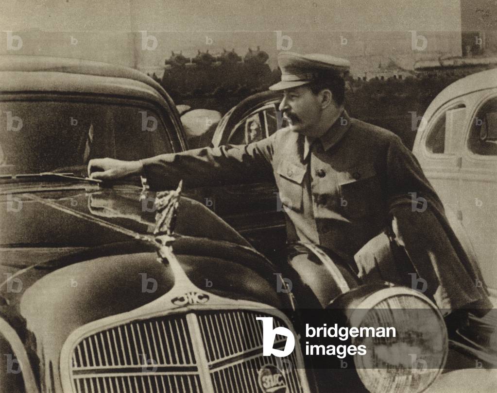 Communist leader Joseph Stalin inspecting the new Soviet ZIS-101 limousine at the Kremlin, Moscow, 1936 (b/w photo)