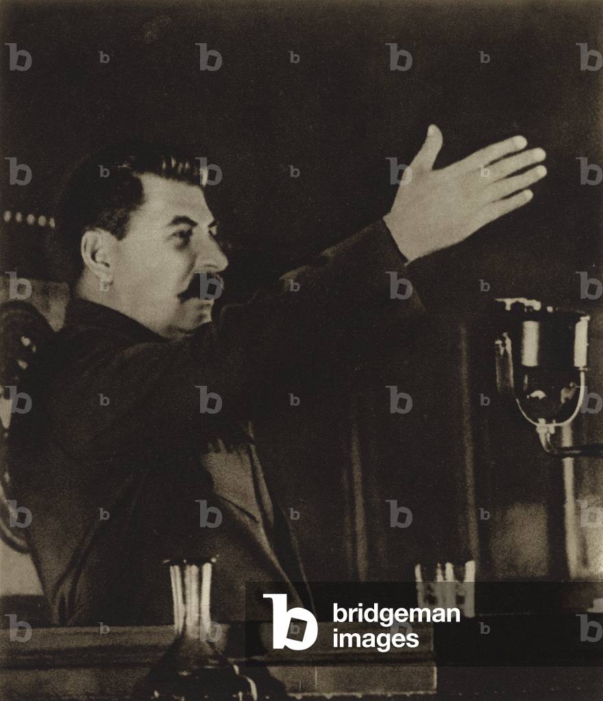 Soviet leader Joseph Stalin reporting on the draft of the new constitution at the 8th All-Union Congress of the Soviets of the USSR, 1936 (b/w photo)
