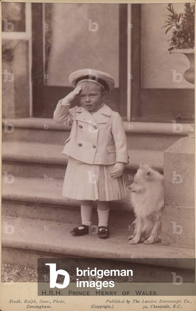 Prince Henry of Wales saluting as he stands on a set of steps (b/w photo)