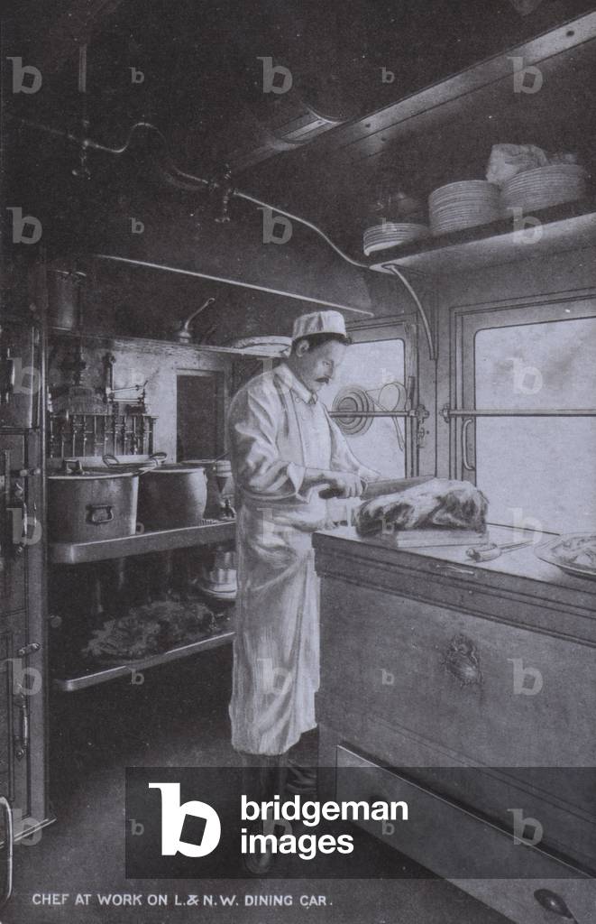 Chef at work on a London & North Western Railway dining car (b/w photo)