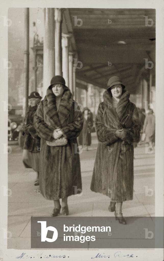Two women in fur coats (b/w photo)