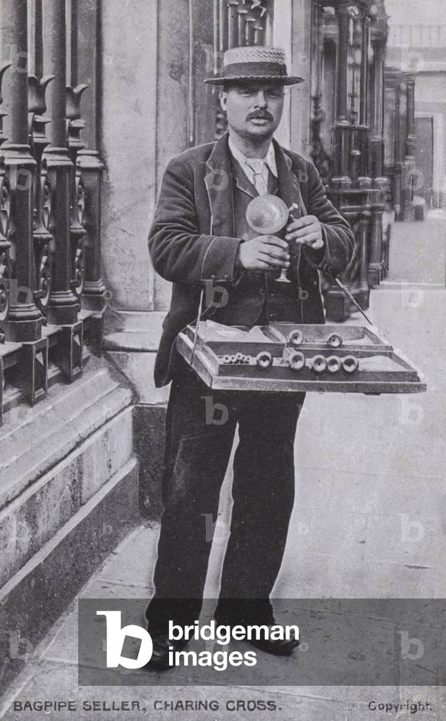 Bagpipe seller, Charing Cross, London (b/w photo)