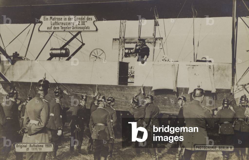 A sailor in the gondola of Zeppelin LZ III at the Tegel firing range, Berlin, 1909 (b/w photo)