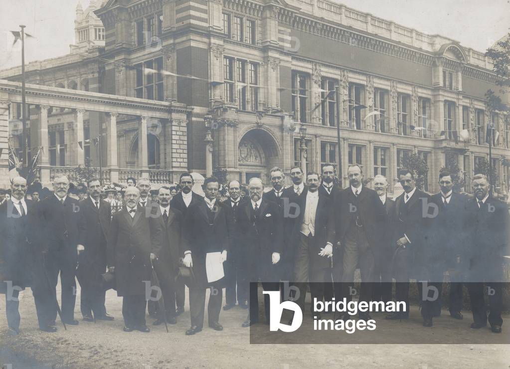 Photo of a group of workmen who presented the address to King Edward VII at the opening of the Victoria and Albert Museum (b/w photo)