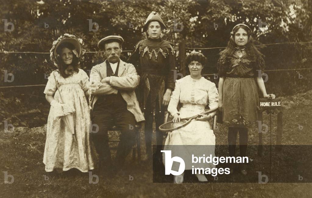 Family wearing fancy dress (b/w photo)