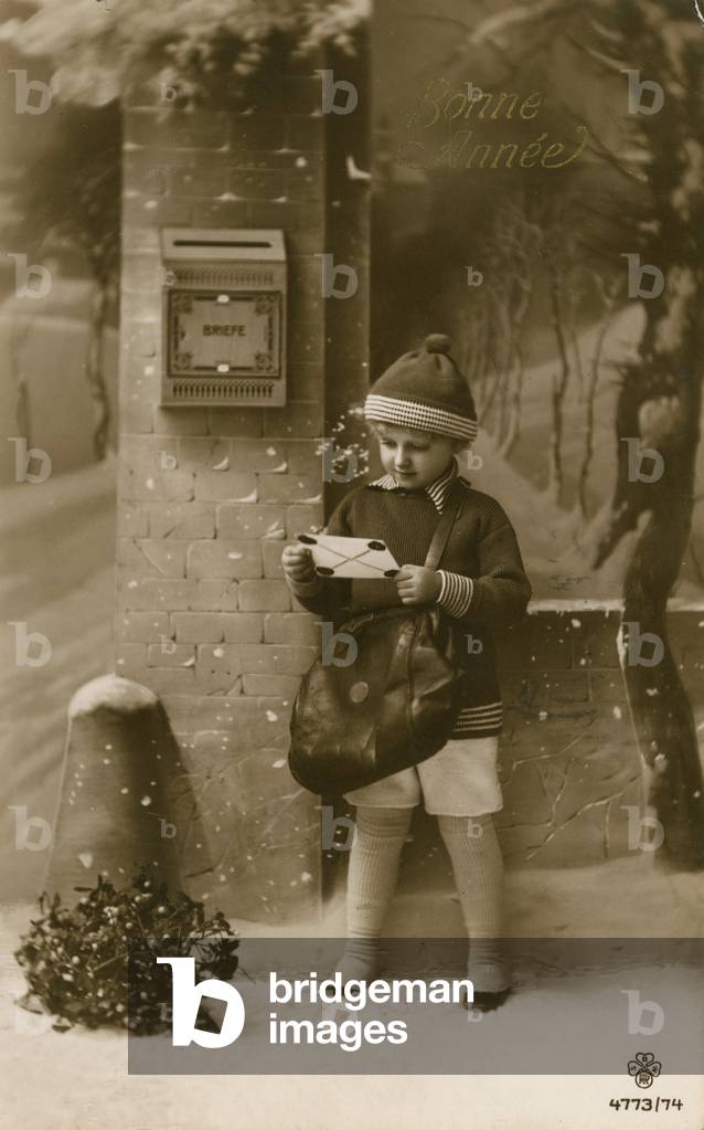 Child about to post letter (b/w photo)