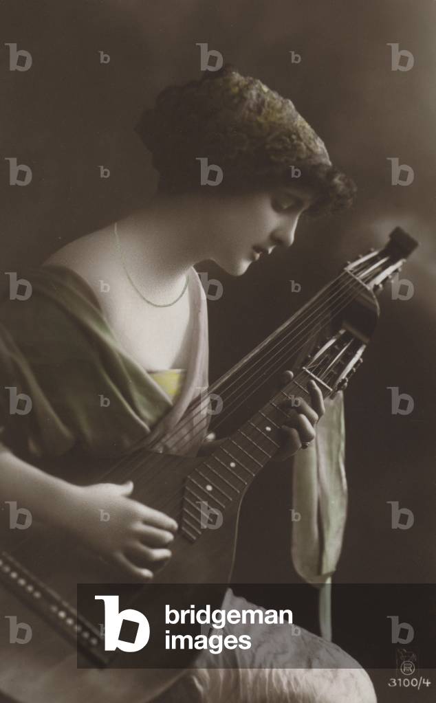 Girl playing a lute (colour photo)