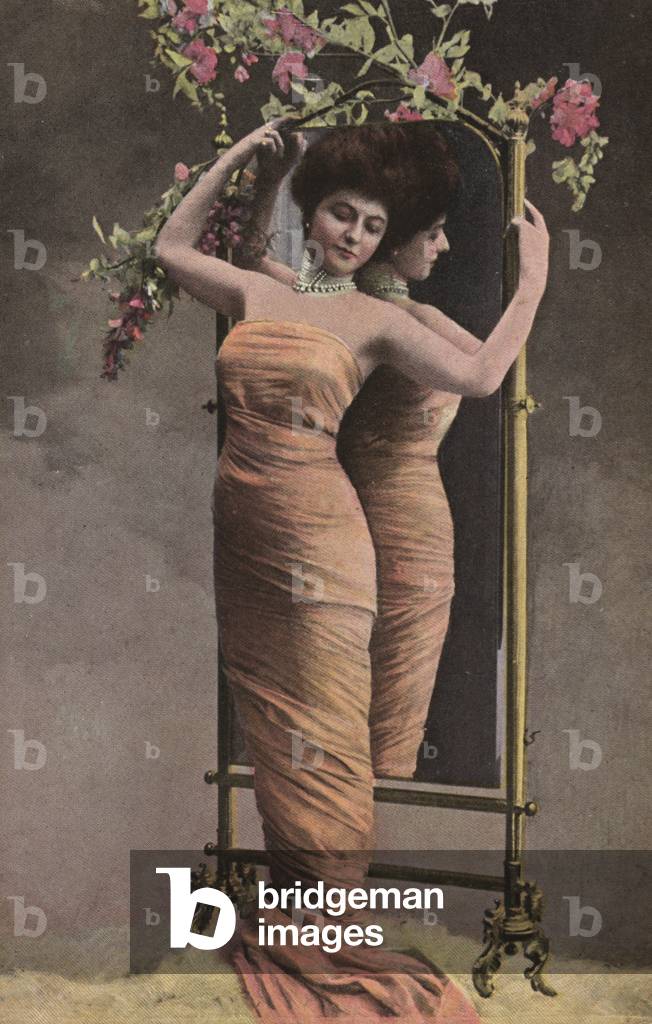 Reflected woman in orange (photo)