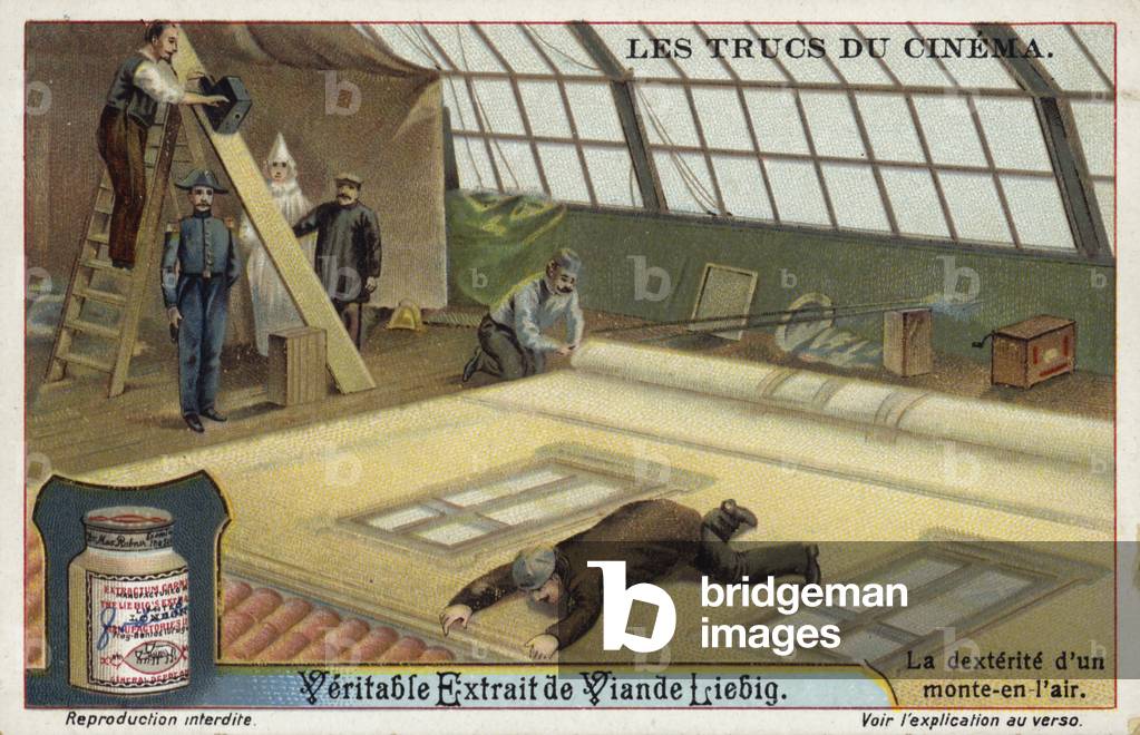 Filming a man climbing a wall (chromolitho)