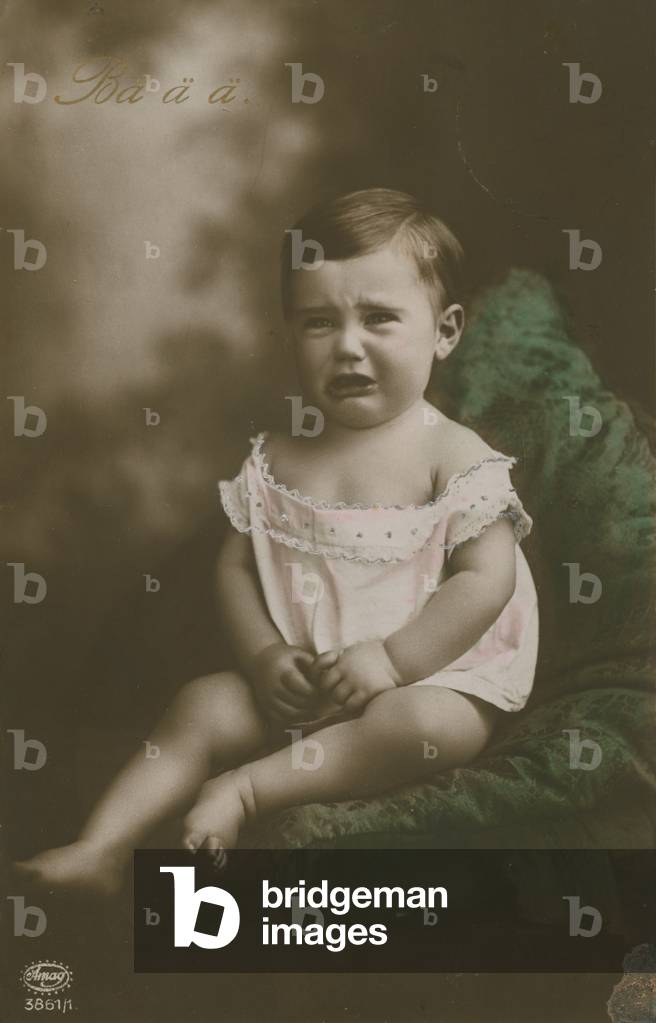 Postcard of a boy crying, sent in 1913 (hand-coloured photo)