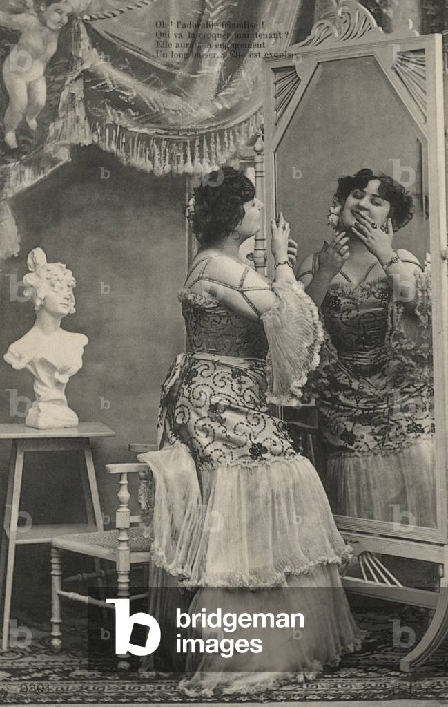 Woman in an elaborate dress (b/w photo)