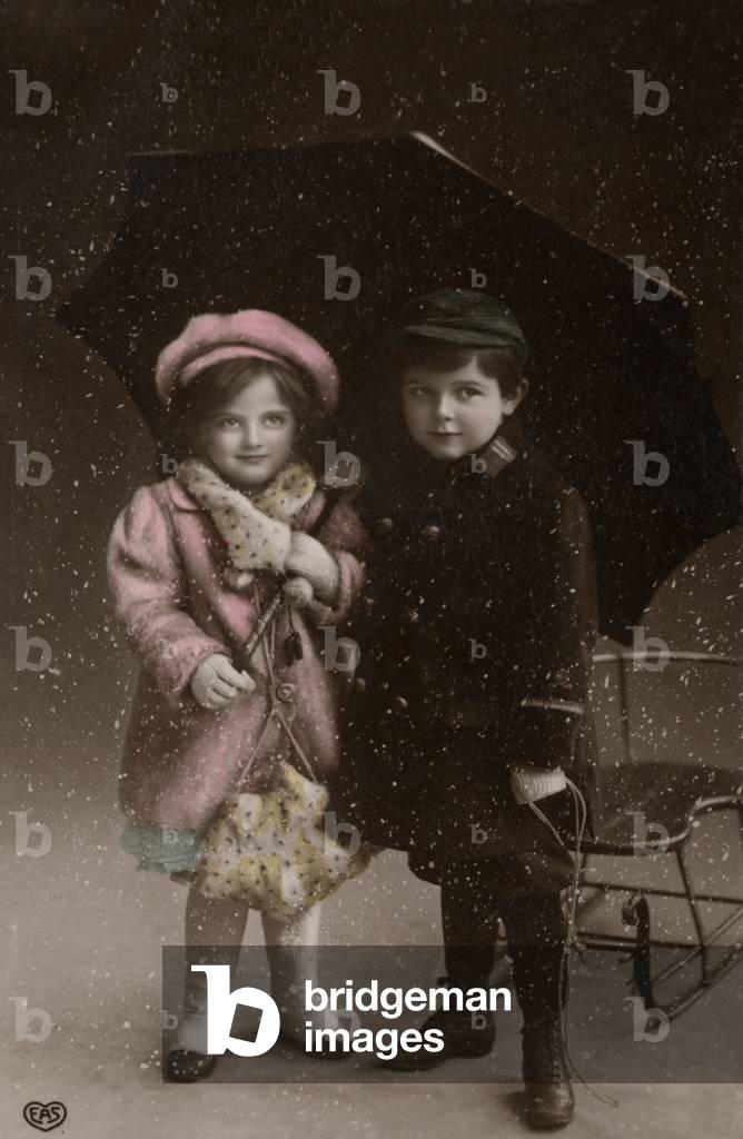 Two children in the snow (colour photo)