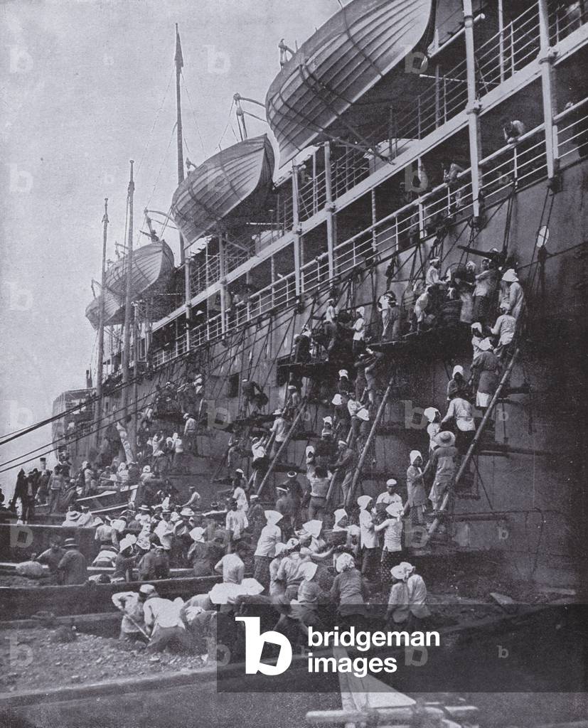 Women coaling a steamer in Nagasaki (b/w photo)