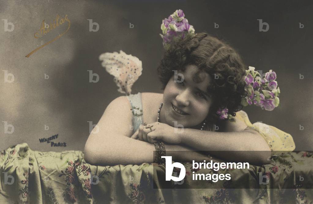Portrait of a woman with flowers in her hair, possibly a French dancer, singer or actress at around the turn of the 20th century (coloured photo)