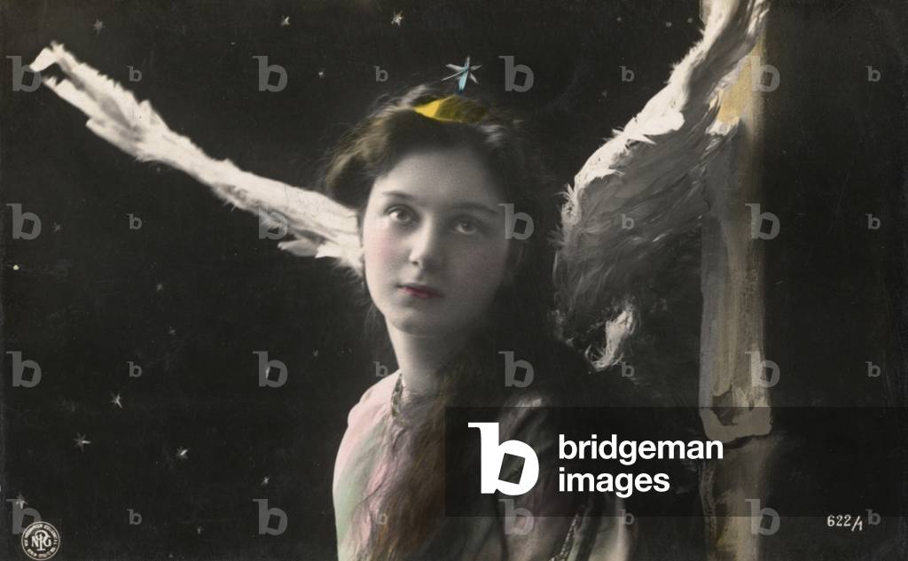 Woman dressed as an angel (colour photo)