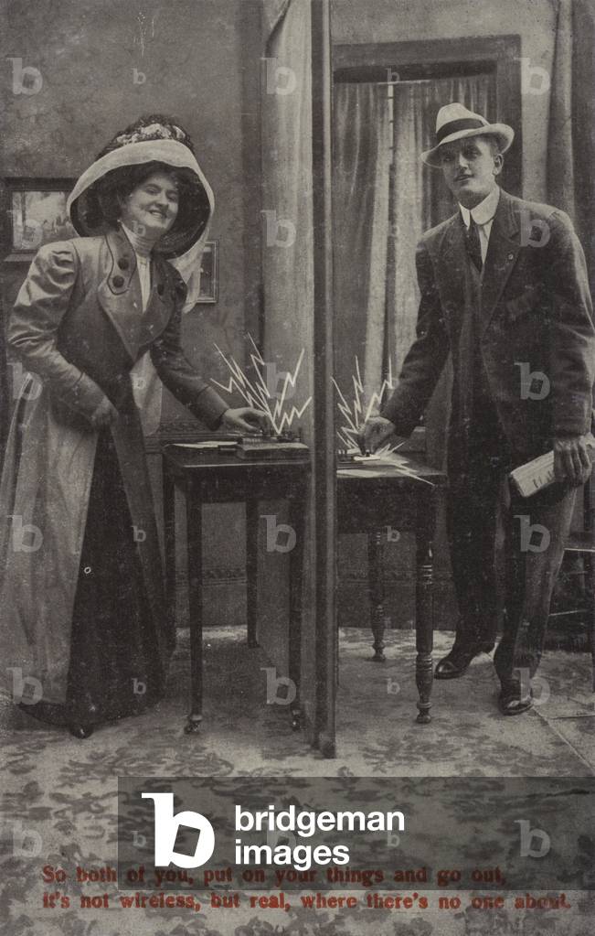 Lovers communicating by wireless (b/w photo)