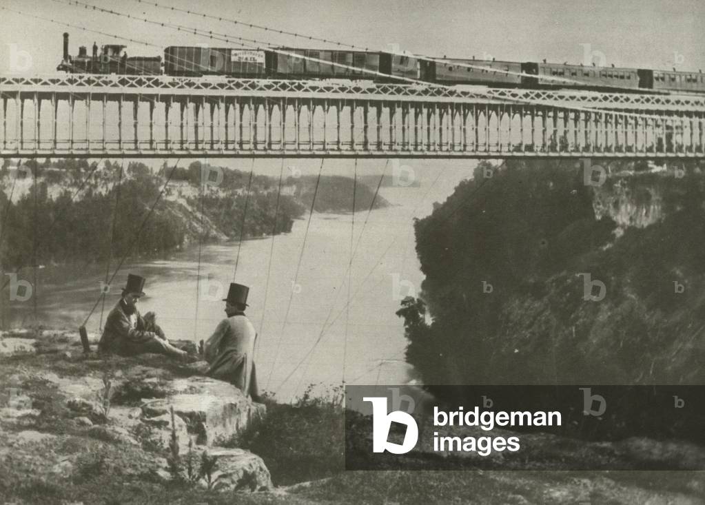 Train crossing the Niagara Suspension Bridge in 1862 (b/w photo)