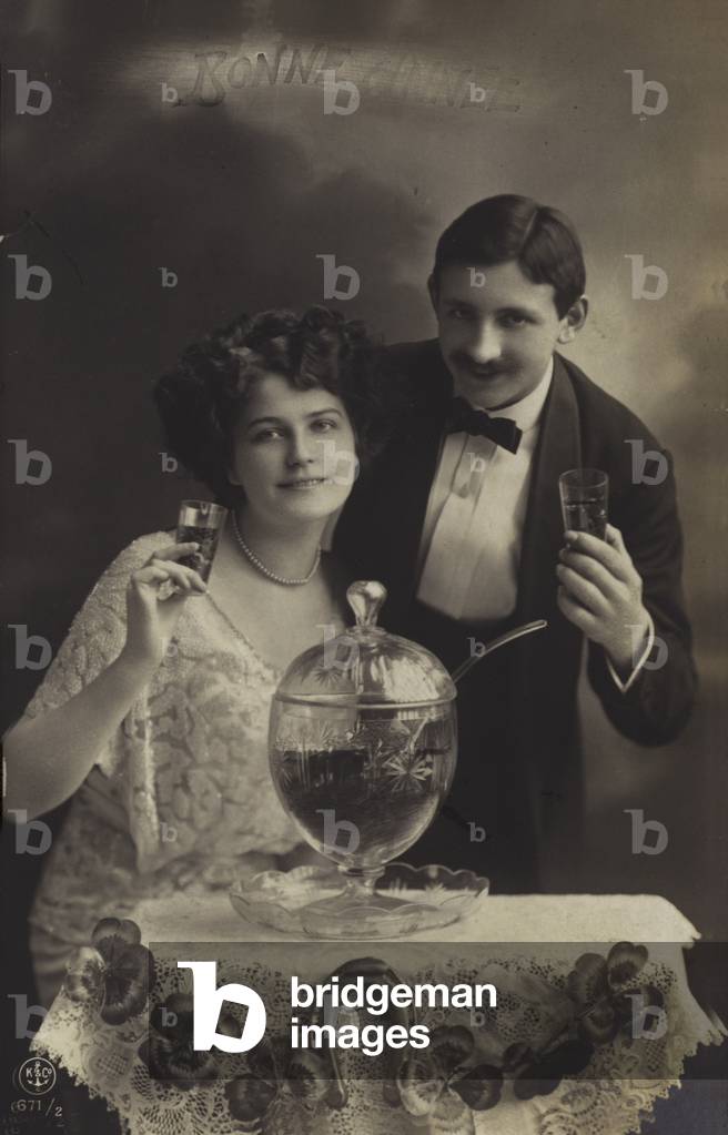 Couple drinking punch (b/w photo)