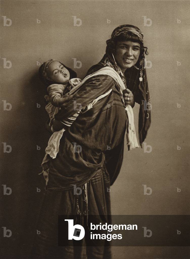 Tunisian Bedouin woman with child (b/w photo)