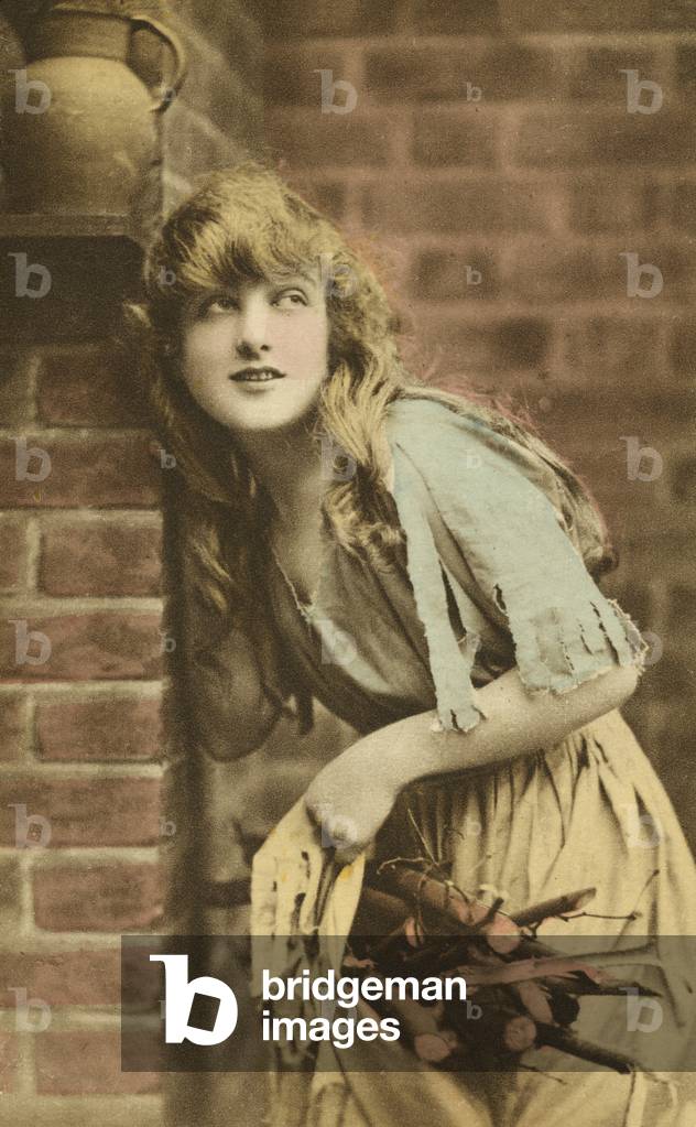 Woman holding bag of sticks (coloured photo)