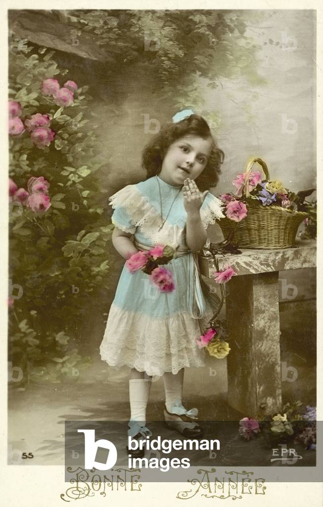 New Year card with little girl in blue (colour photo)