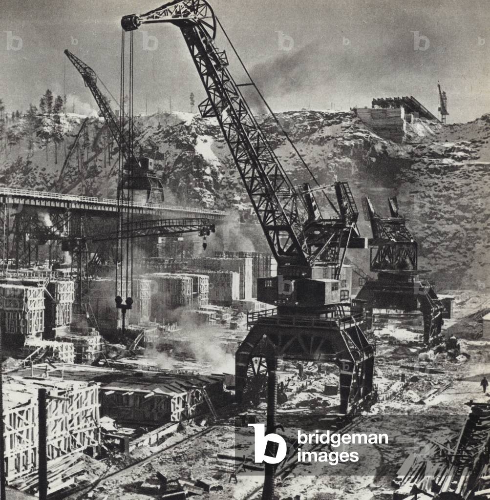 USSR circa 1960: The construction site of the Bratsk Power Station on the Angara in Siberia (b/w photo)