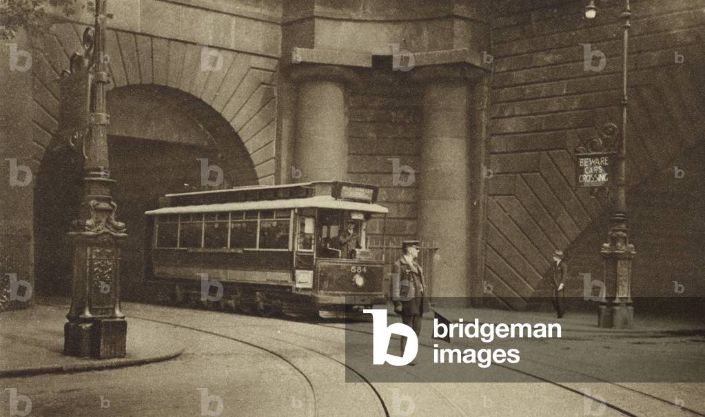 Tram emerging from the tunnel running beneath Kingsway, Aldwych and Somerset House to connect the North London system with the loop line along the Embankment (b/w photo)