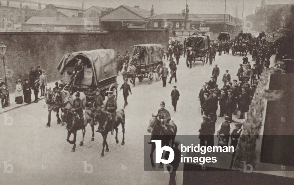 Soldiers and police escorting a food convoy from the docks during the British rail strike of August 1911 (b/w photo)