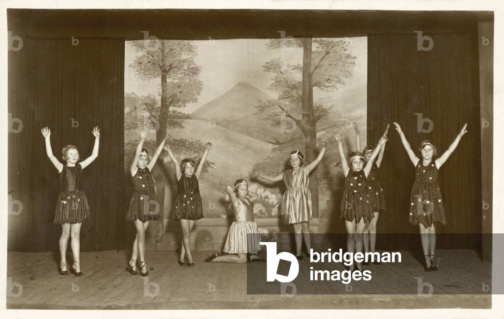 Girls dancing in school play or ballet (b/w photo)