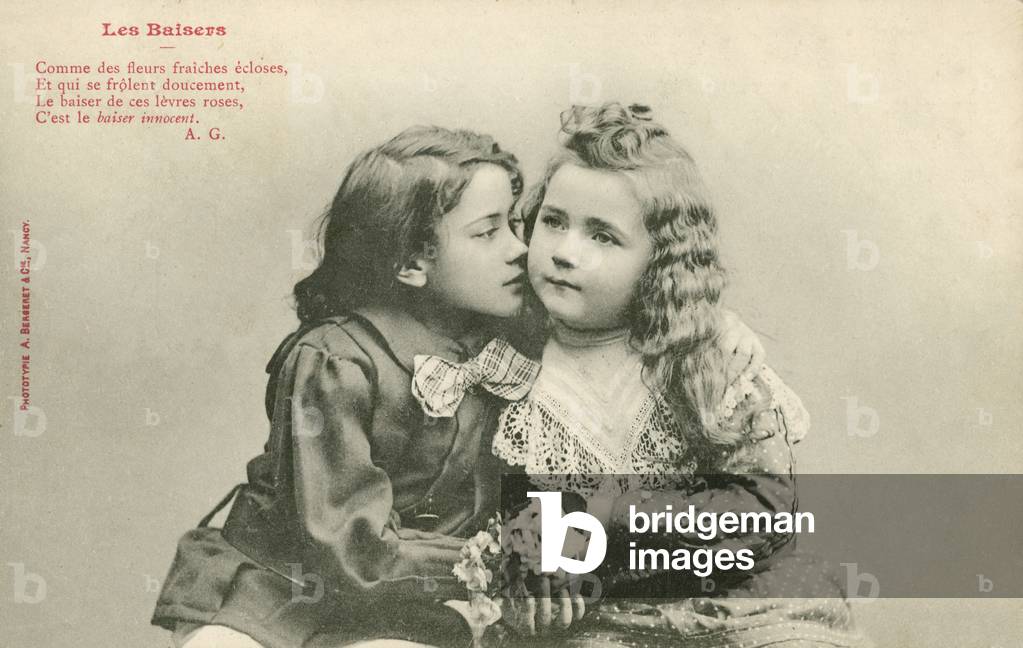 Little boy kissing a little girl (b/w photo)