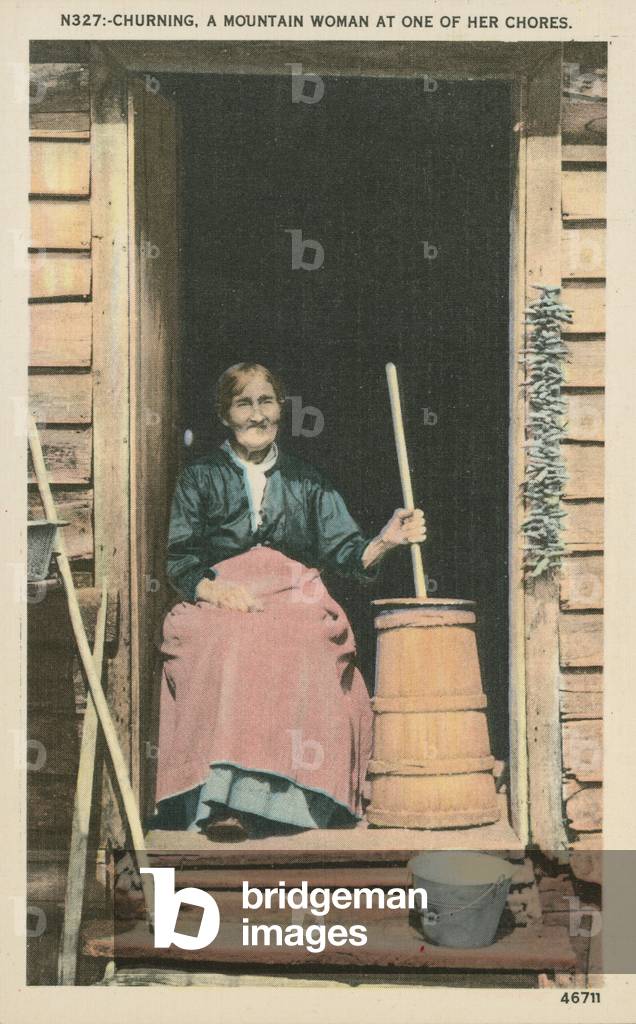 Woman churning butter (colour photo)