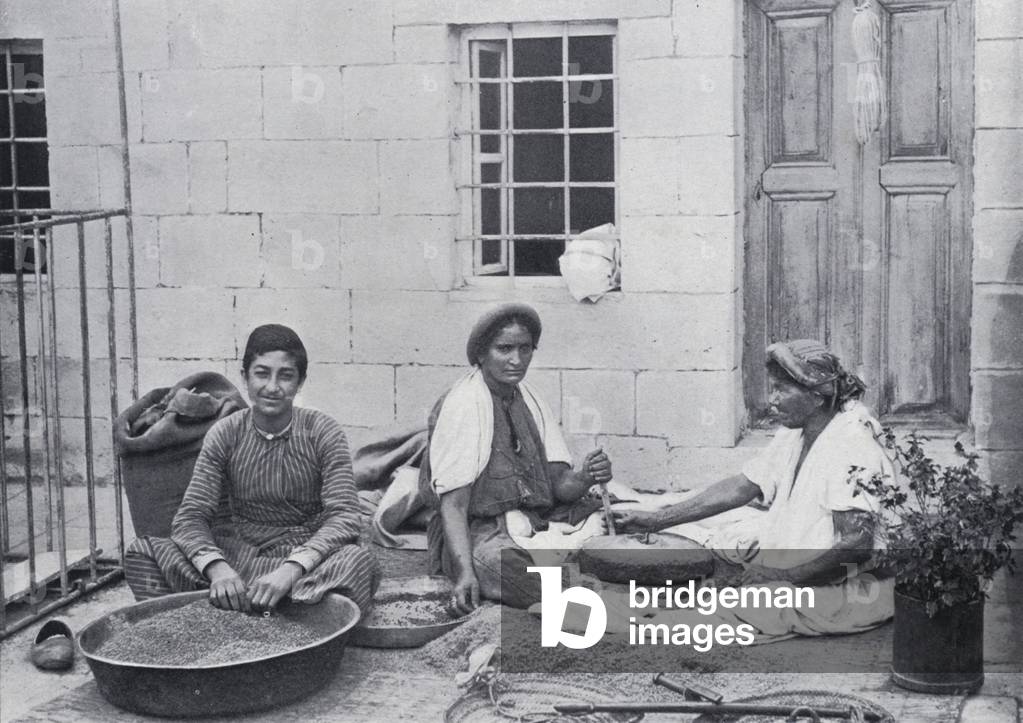 Natives grinding Corn in Jerusalem (b/w photo)
