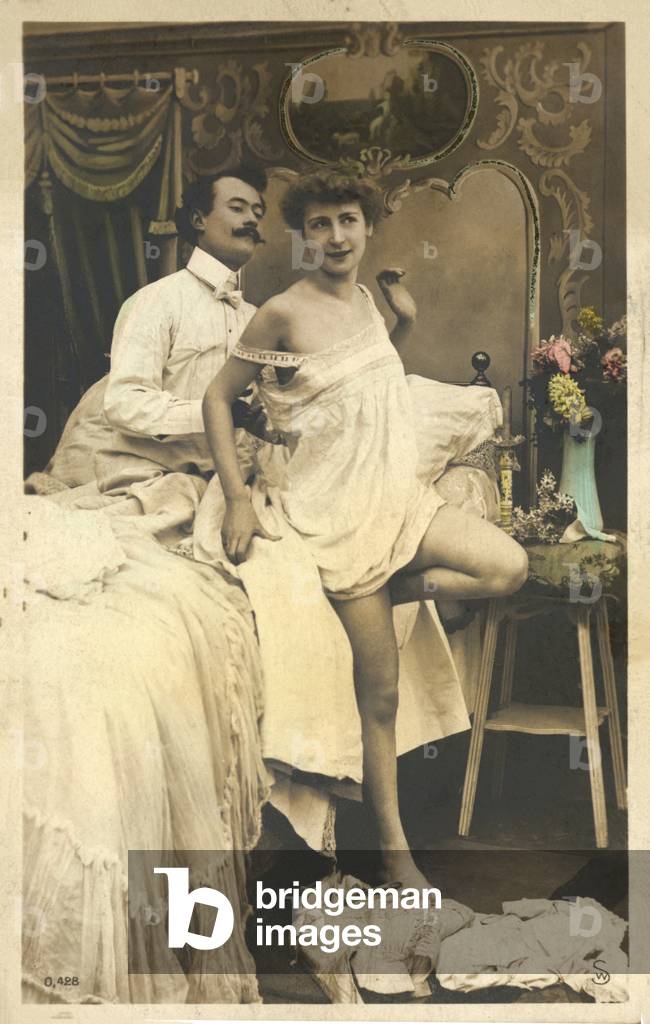 Woman being undressed (colour photo)