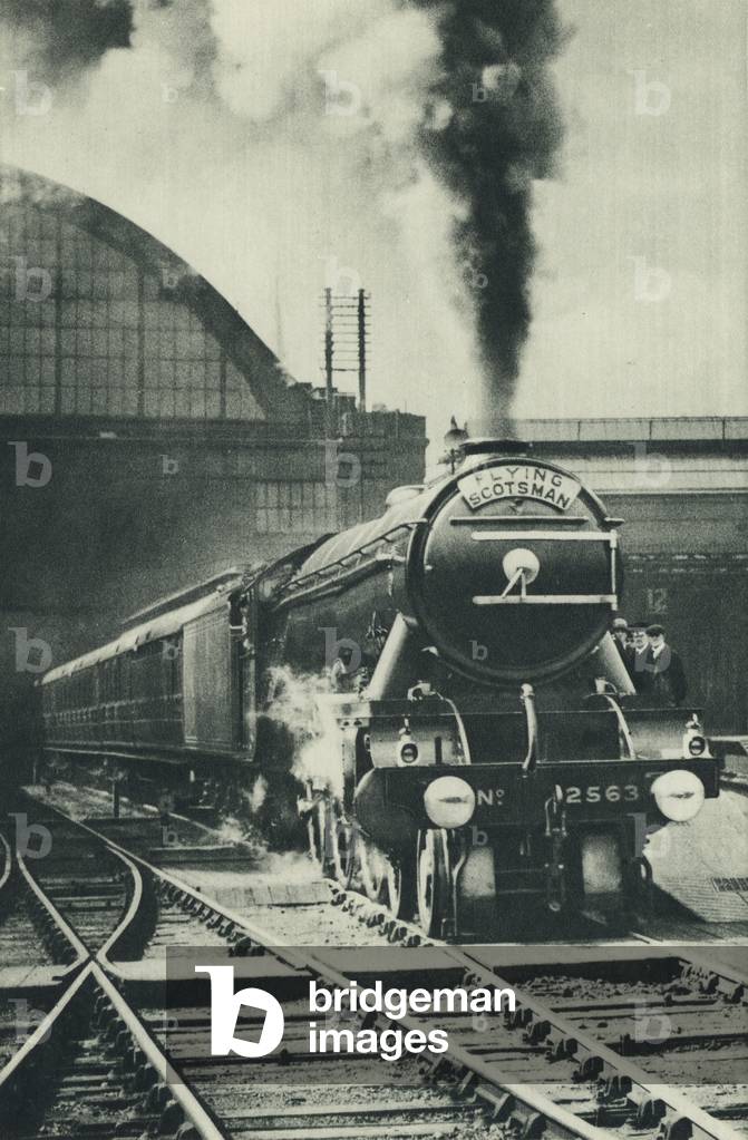 The Flying Scotsman leaving King's Cross Station, London (b/w photo)