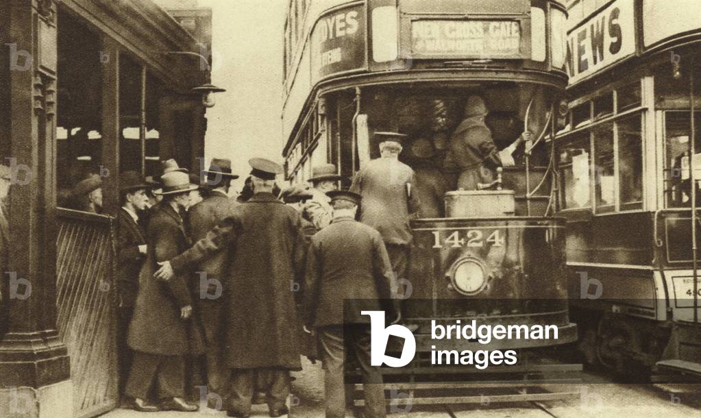 Herding passengers onto the tram at Blackfriars (b/w photo)