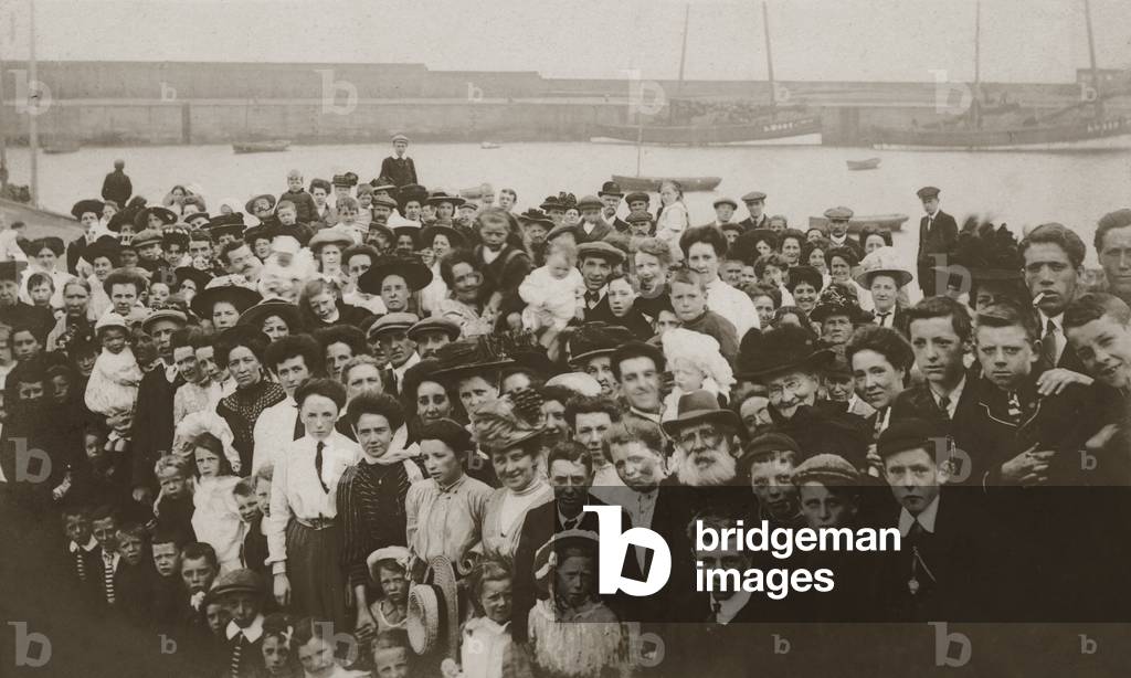 Passengers on a quayside for a boat trip (b/w photo)