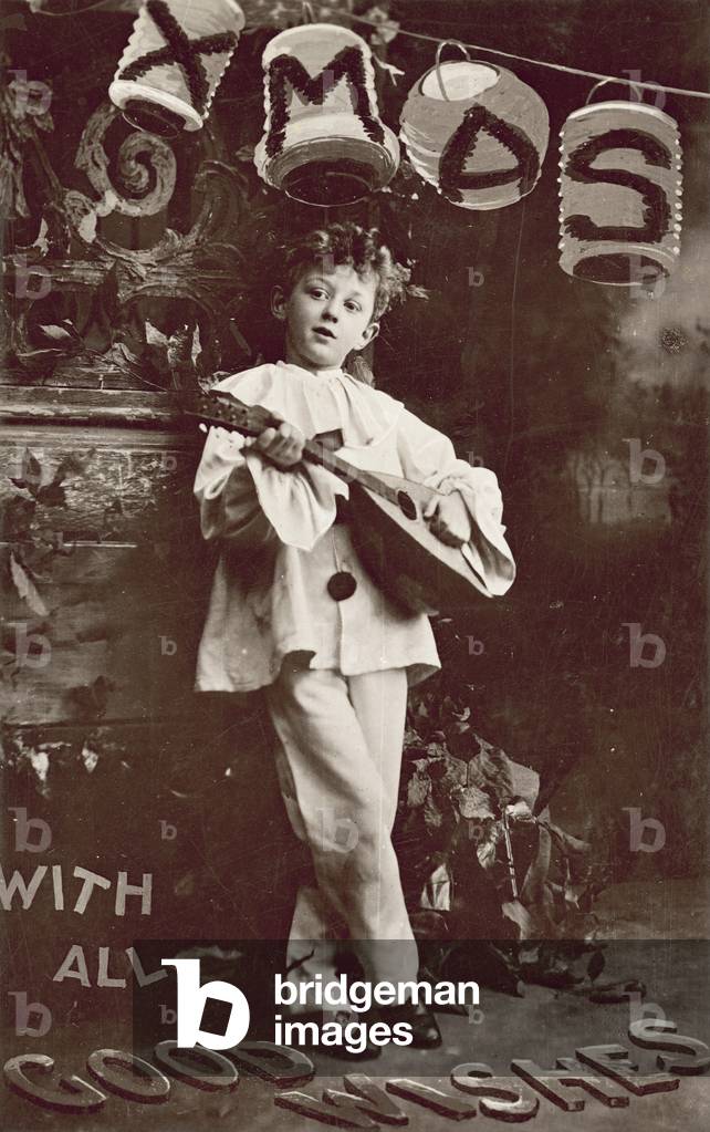 Boy playing a lute (b/w photo)