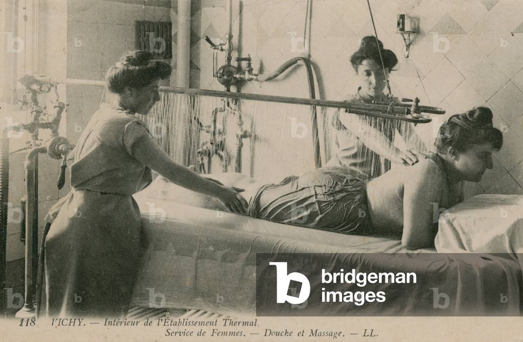 Postcard of a woman receiving a shower and massage at the thermal baths in Vichy, sent in 1913 (b/w photo)