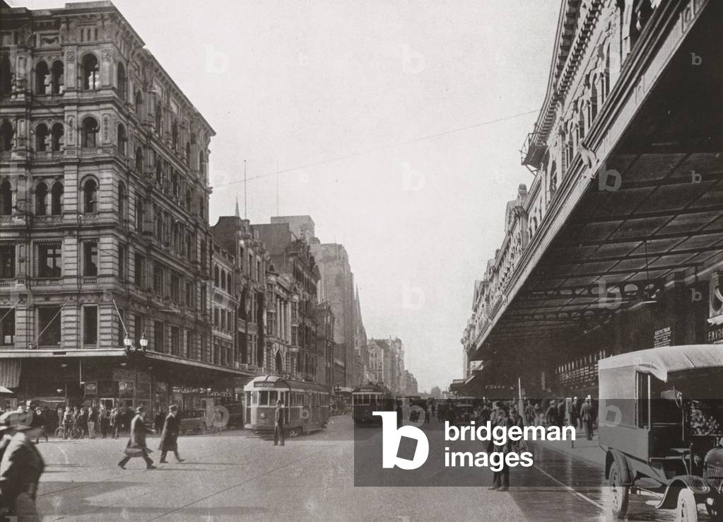 Flinders Street, Melbourne, looking east from Elizabeth Street Terminus (b/w photo)