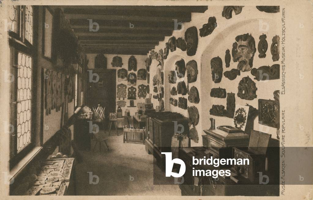 Alsatian Museum with display of wooden sculptures.  Postcard sent in 1913.