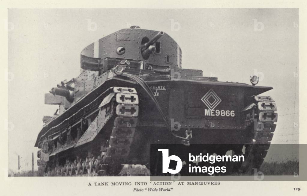 A tank moving into 'action' at manoeuvres (b/w photo)