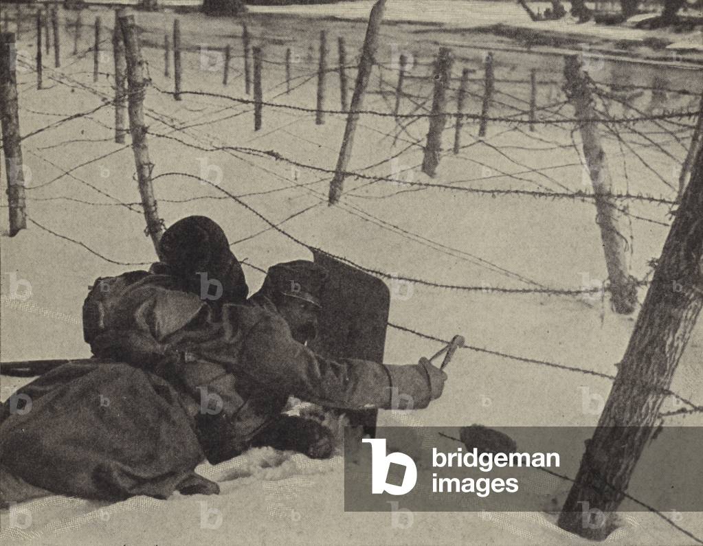 Cutting barbed wire (b/w photo)