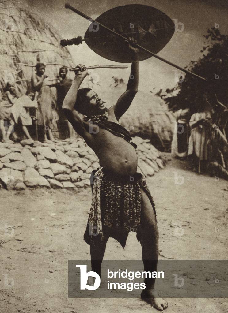 Zulu rainmaker performing a rain dance, South Africa (b/w photo)
