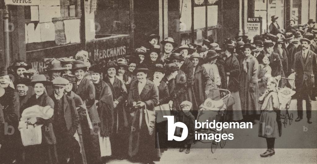 People queuing for their sugar ration on a South London street, World War I, 1918 (b/w photo)