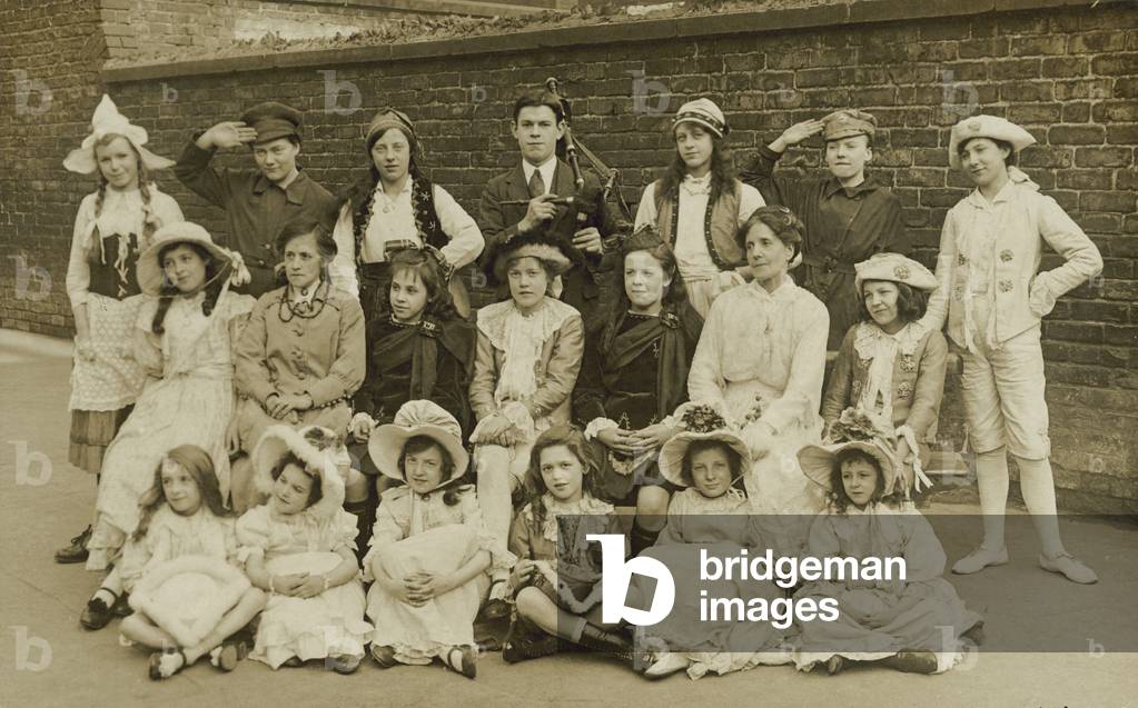 Group of children in various costumes (b/w photo)